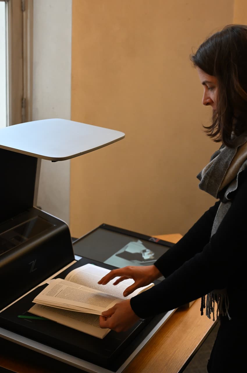 Digitisation of archive material: Anna Busch scanning a book Digitisation of archive material: Anna Busch scanning a book